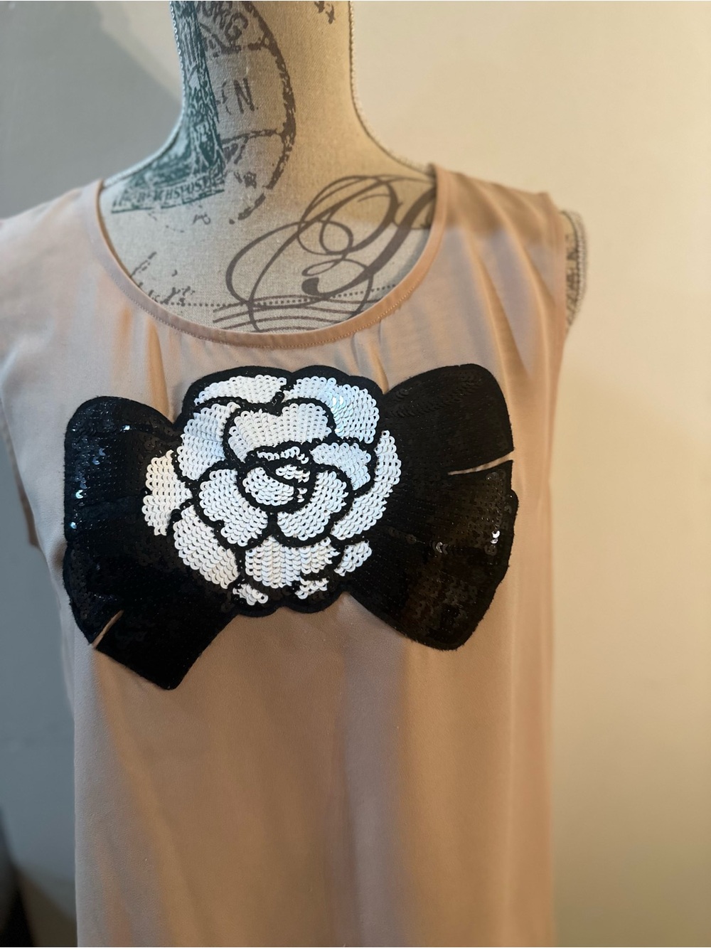 Beige Sleeveless Camisole with Black Bow & White Floral Sequin Detail